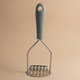 Al Saif Gallery steel potato masher, with silicone handle - green product image 1